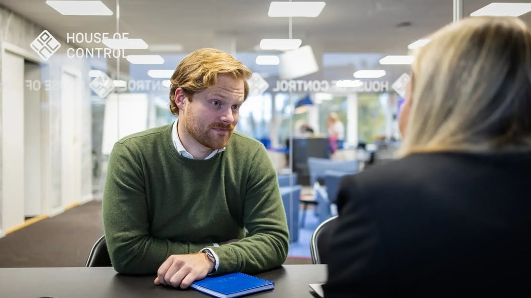 Man and a woman having a conversation in the office