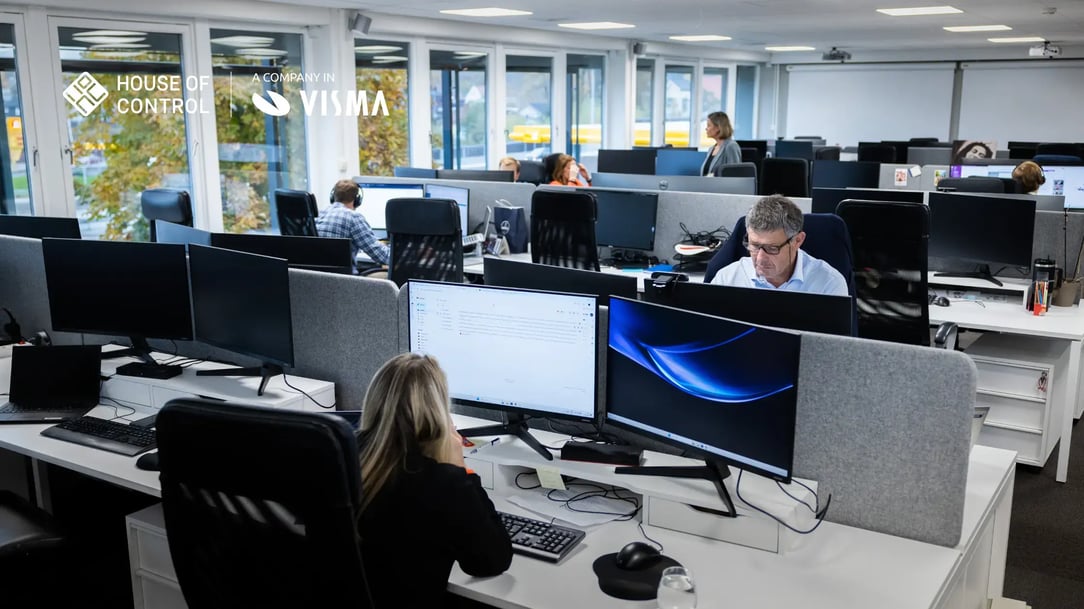 House of Control employees in the office, working behind their computers