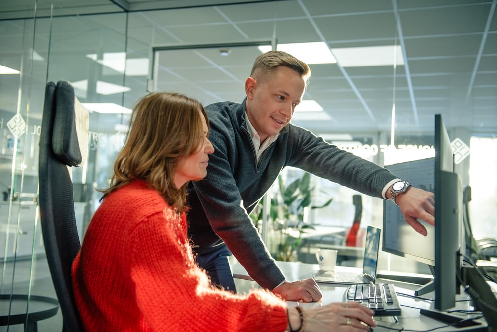 Man pointing at a computer screen