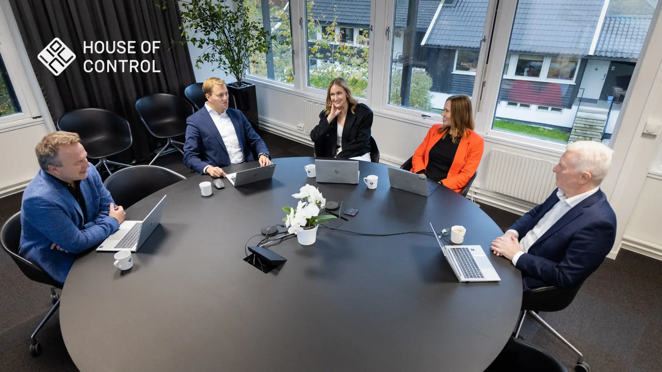Five people in a meeting