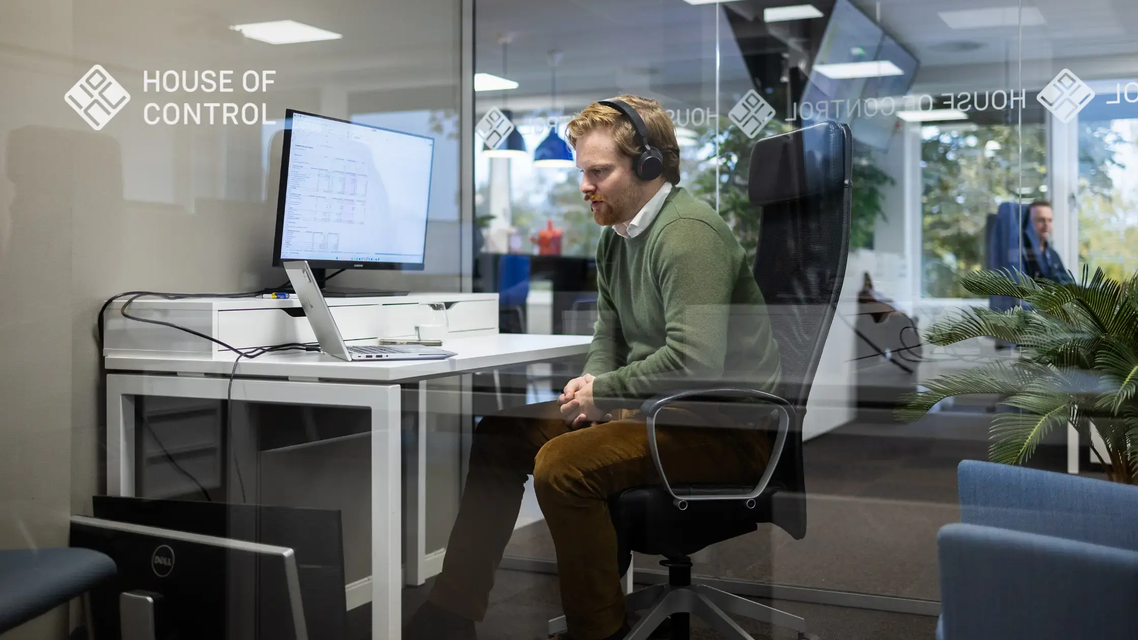 Man looking at the computer in the office