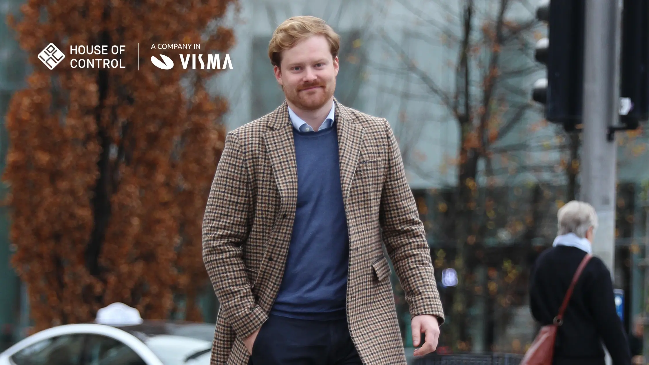Man walking casually in the city while smiling