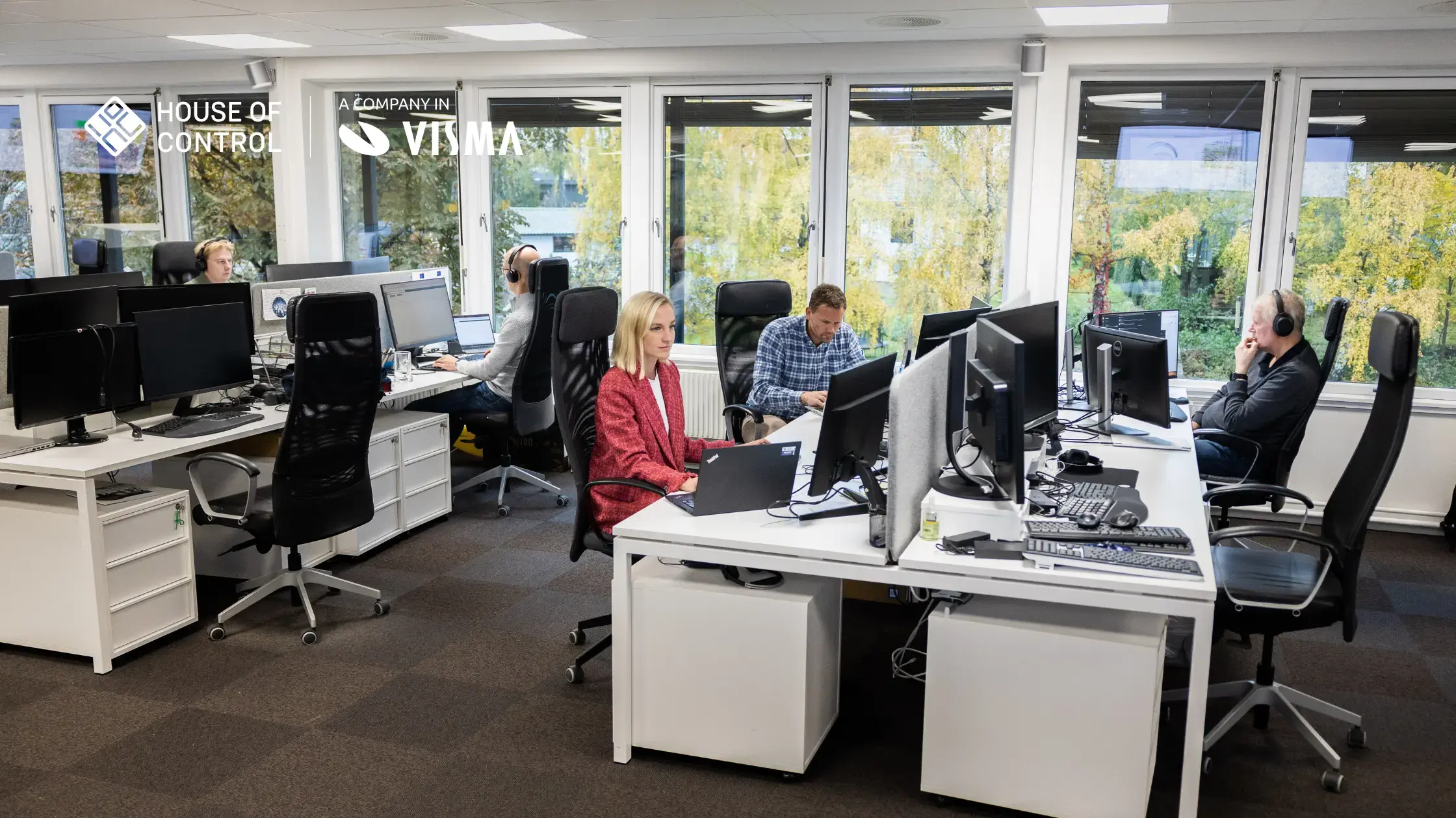 People sitting at their desks in the office