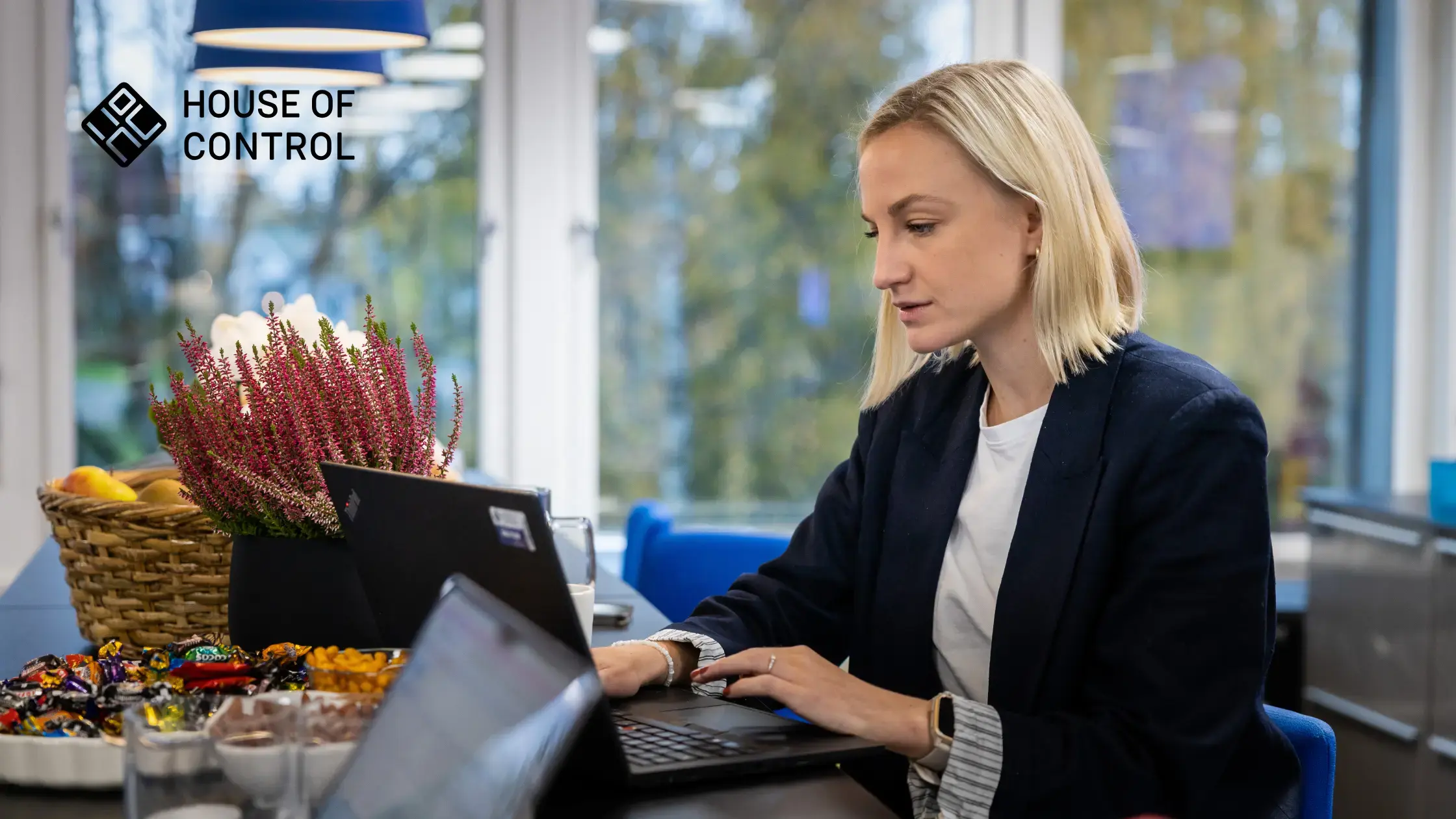 Blonde woman looking at her computer