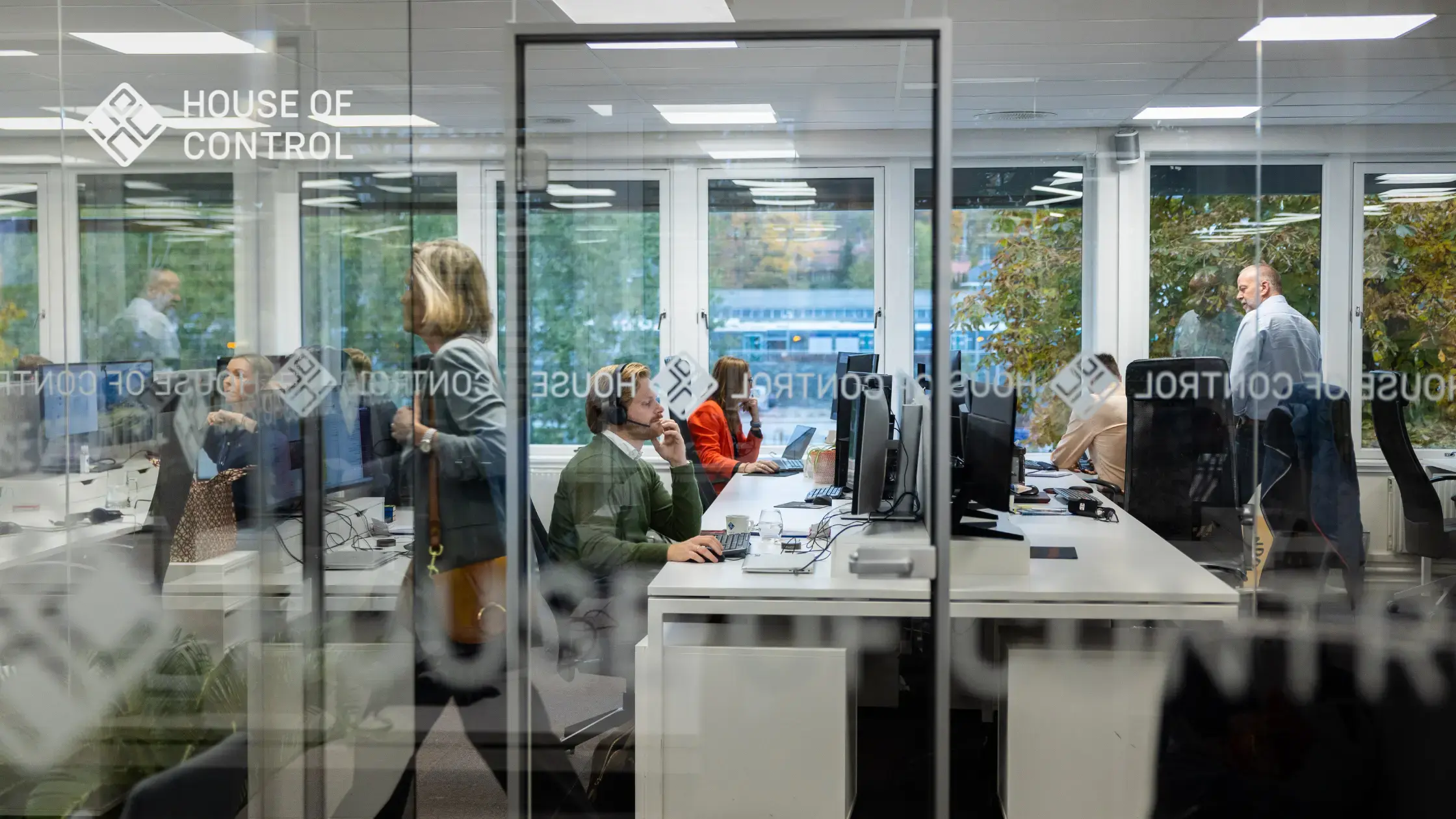 A group of employees at House of Control sitting down in the office